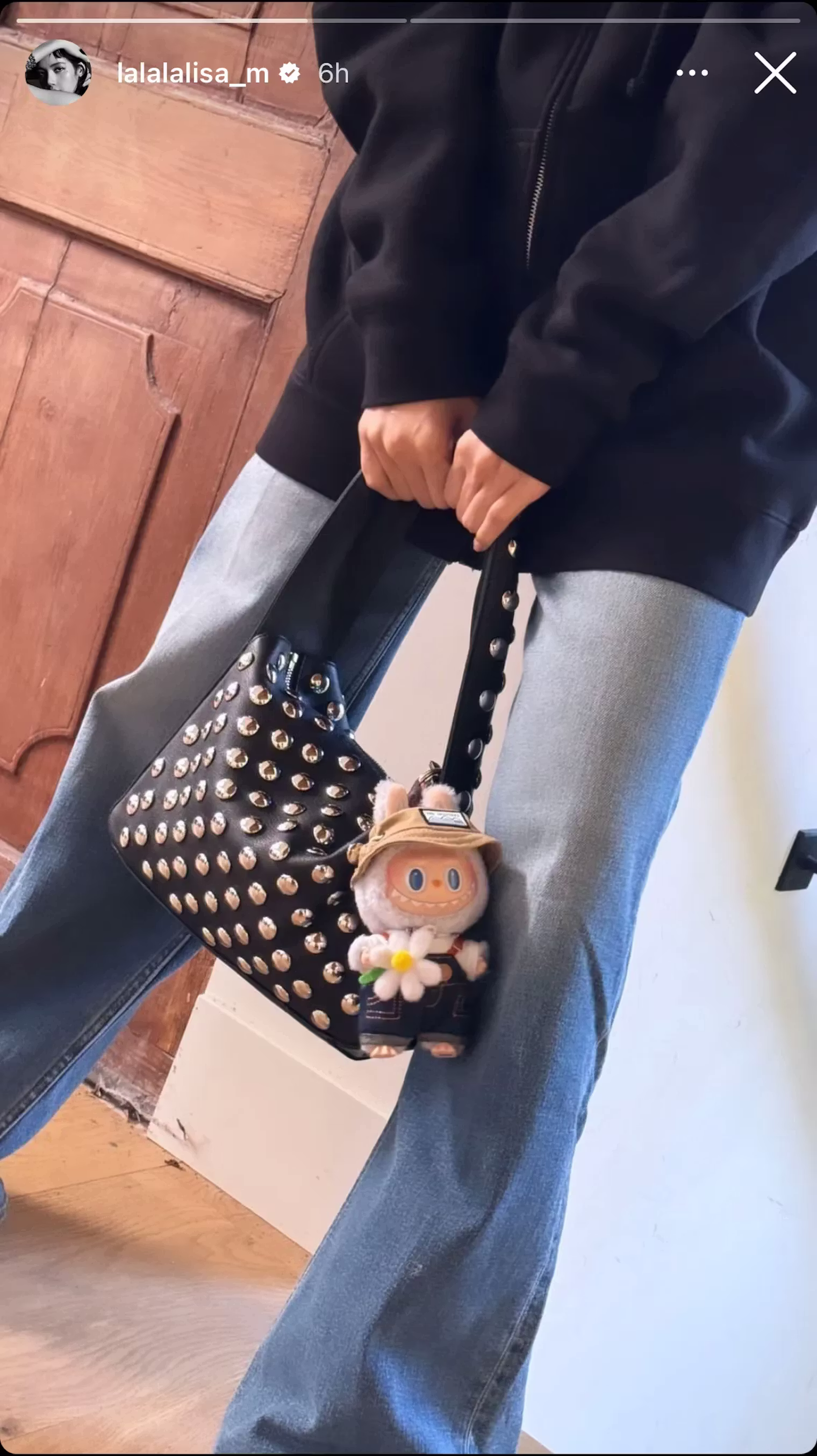 Lisa's Instagram story showing Labubu plush on handbag